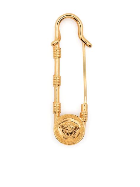 versace chain reaction safety pin|Versace brooch.